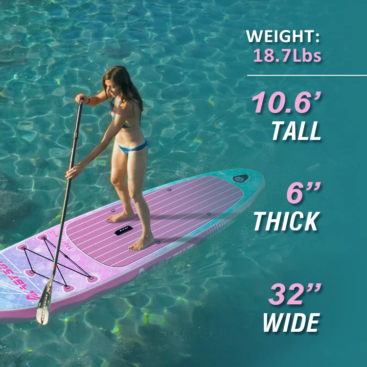 Woman standing on a pink and purple paddleboard in clear water, holding a paddle. Paddleboard specifications visible alongside.