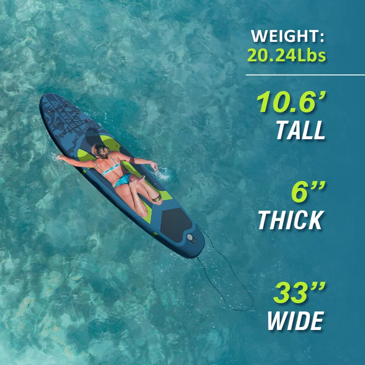 Woman in a bikini relaxing on a paddleboard in clear blue ocean water. Paddleboard specifications include weight, height, thickness, and width.