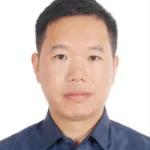 Person in a navy blue shirt with face blurred, shown in a profile photo style.