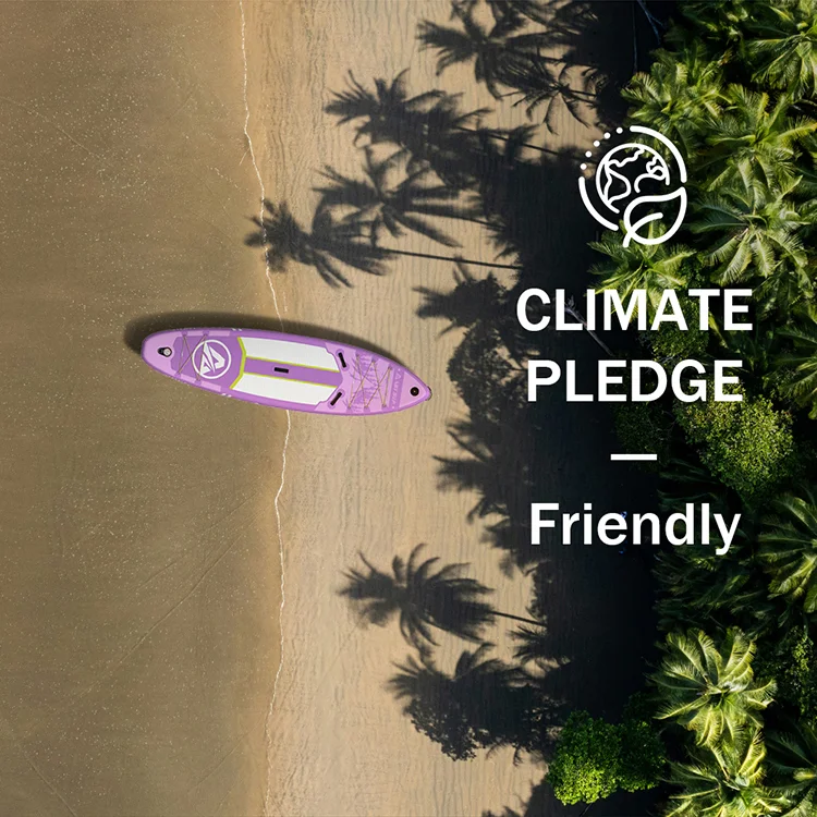 Purple paddleboard on a sandy beach surrounded by palm tree shadows, with 'Climate Pledge - Friendly' text to promote sustainability.